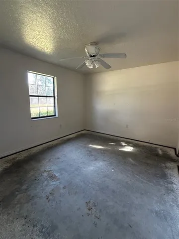 an empty room with a empty space and a window