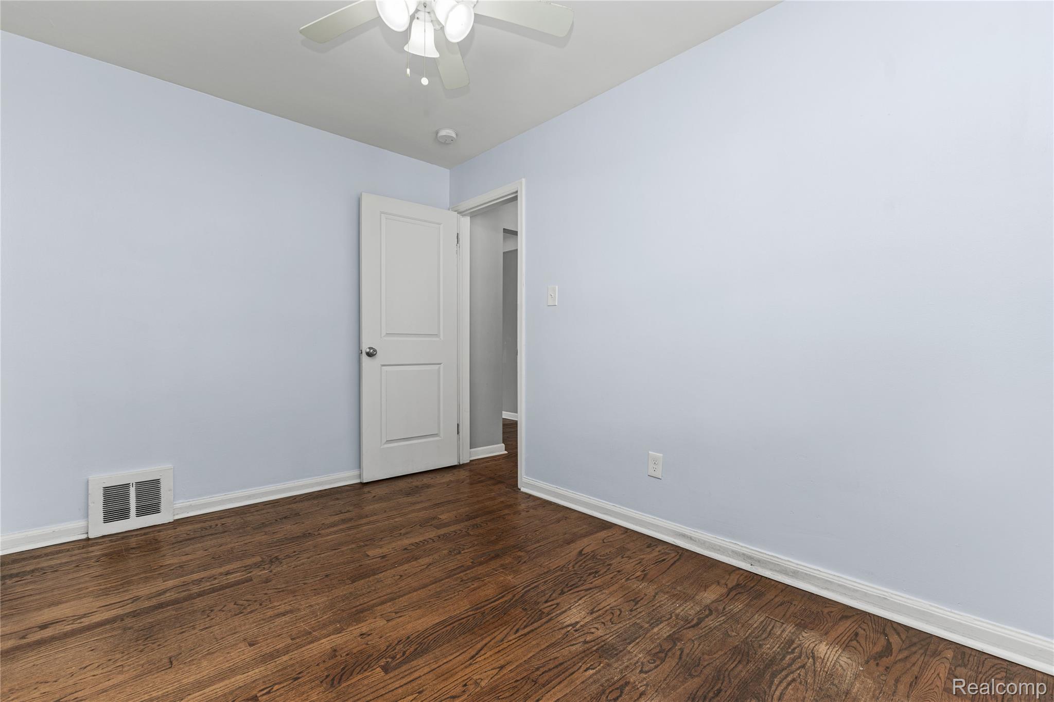 26508 Five Mile Road Redford, MI 48239 - Photo 29 of 41 Hardwood flooring with light blue walls and white trim