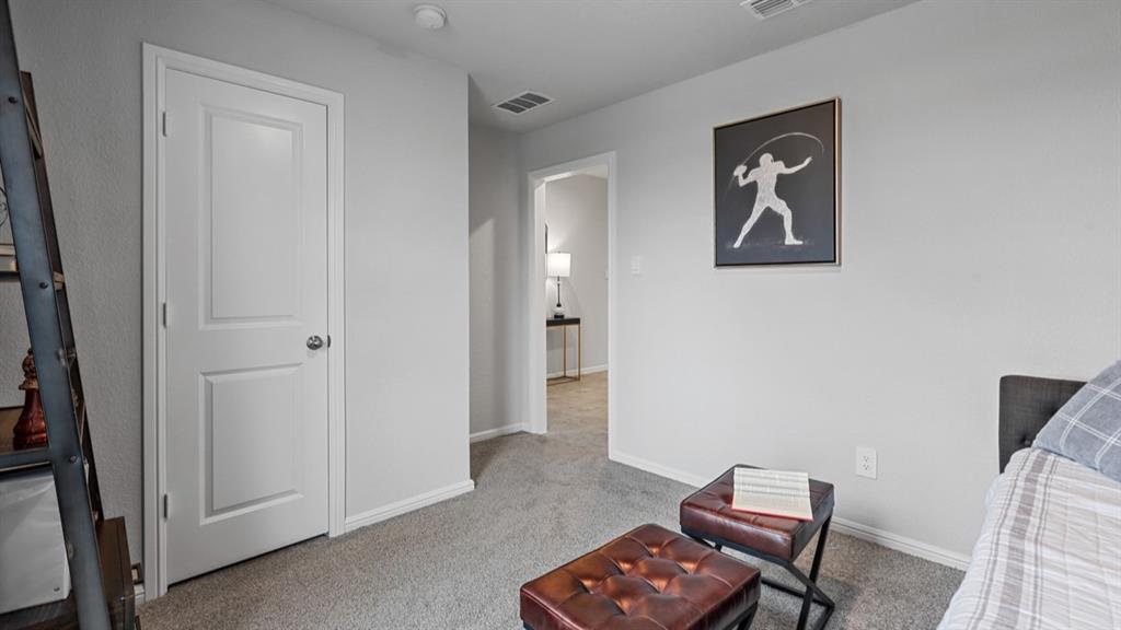 8509 Beltmill Parkway Fort Worth, TX 76131 - Photo 22 of 40 a view of room with lounge chair and wooden floor