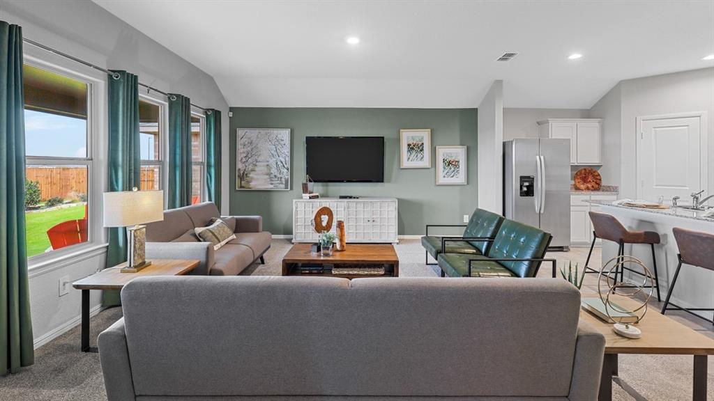 8509 Beltmill Parkway Fort Worth, TX 76131 - Photo 5 of 40 a living room with furniture and a flat screen tv