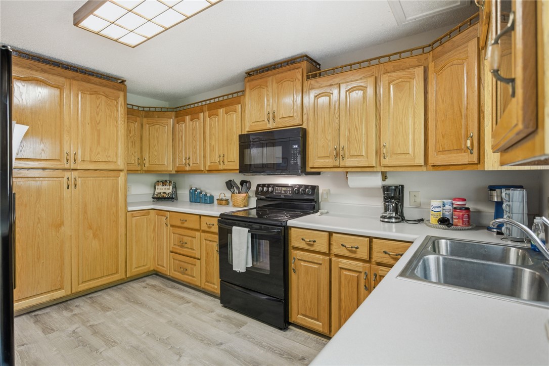 110 Snug Harbor Road Seneca, SC 29678 - Photo 11 of 37 This spacious kitchen offers ample cabinetry and counter space, ideal for culinary creations.