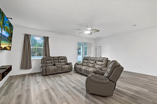 a living room with furniture and a large window
