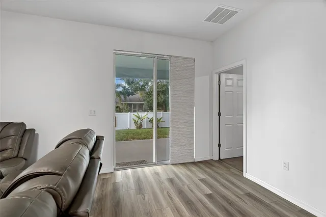 a view of room with furniture and windows