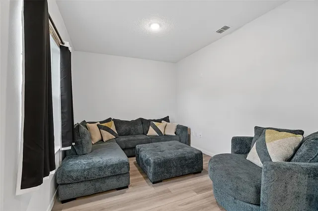 a living room with furniture and a couch