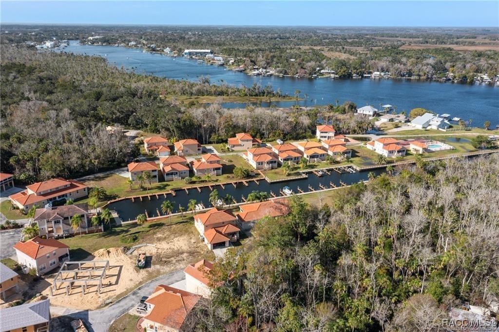 4865 South Tromp Loop Homosassa, FL 34448 - Photo 27 of 30 an aerial view of lake and city