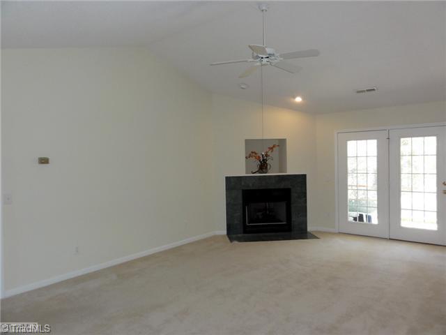 3810 Payne Road High Point, NC 27265 - Photo 3 of 16 Den/Family/Great Room. The living room features vaulted ceilings, fireplace with gas logs, and French doors that lead to the screened porch!