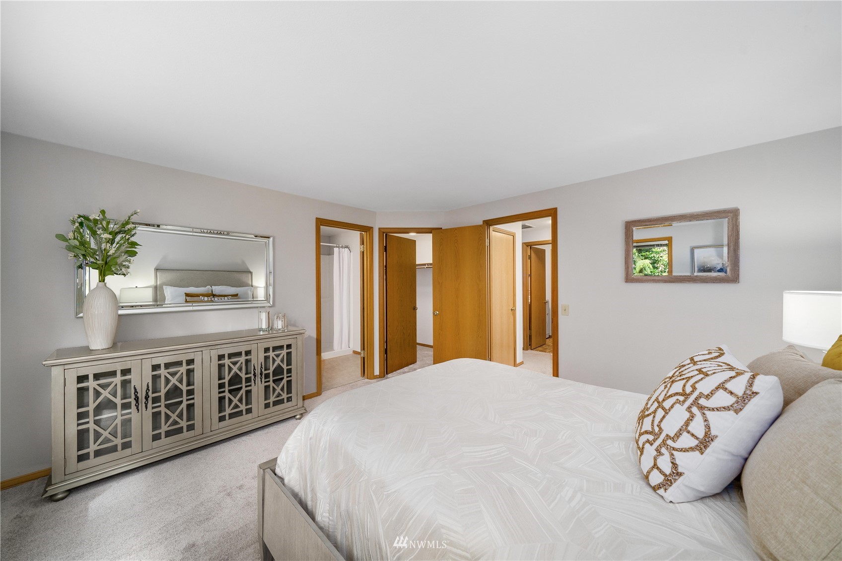 1516 243rd Place Southeast Bothell, WA 98021 - Photo 14 of 30 a bedroom with a bed a dresser and next to a window