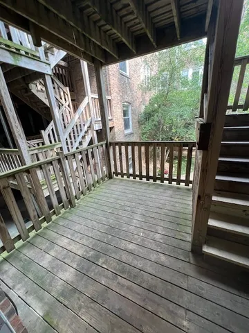 a view of balcony with wooden floor