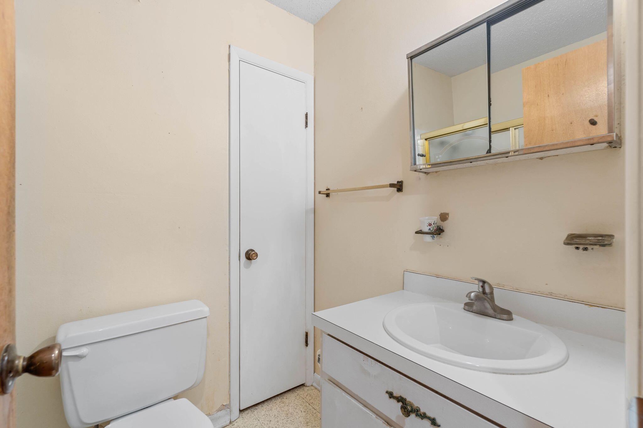 55 12th Street Shalimar, FL 32579 - Photo 14 of 22 a bathroom with a sink a toilet and vanity