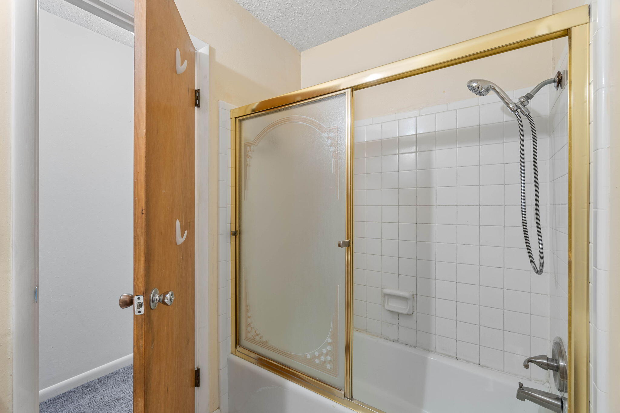 55 12th Street Shalimar, FL 32579 - Photo 15 of 22 a bathroom with a glass shower door