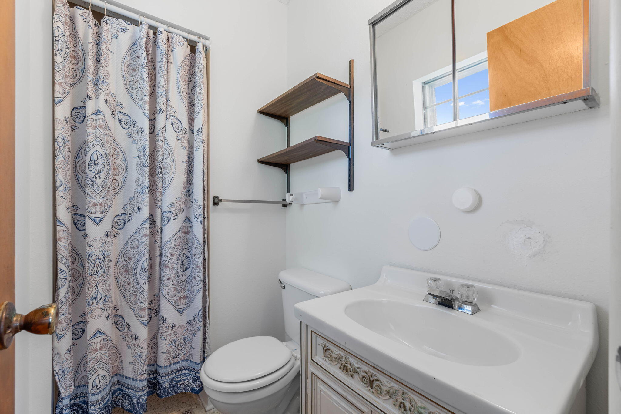 55 12th Street Shalimar, FL 32579 - Photo 18 of 22 a bathroom with a sink toilet and shower