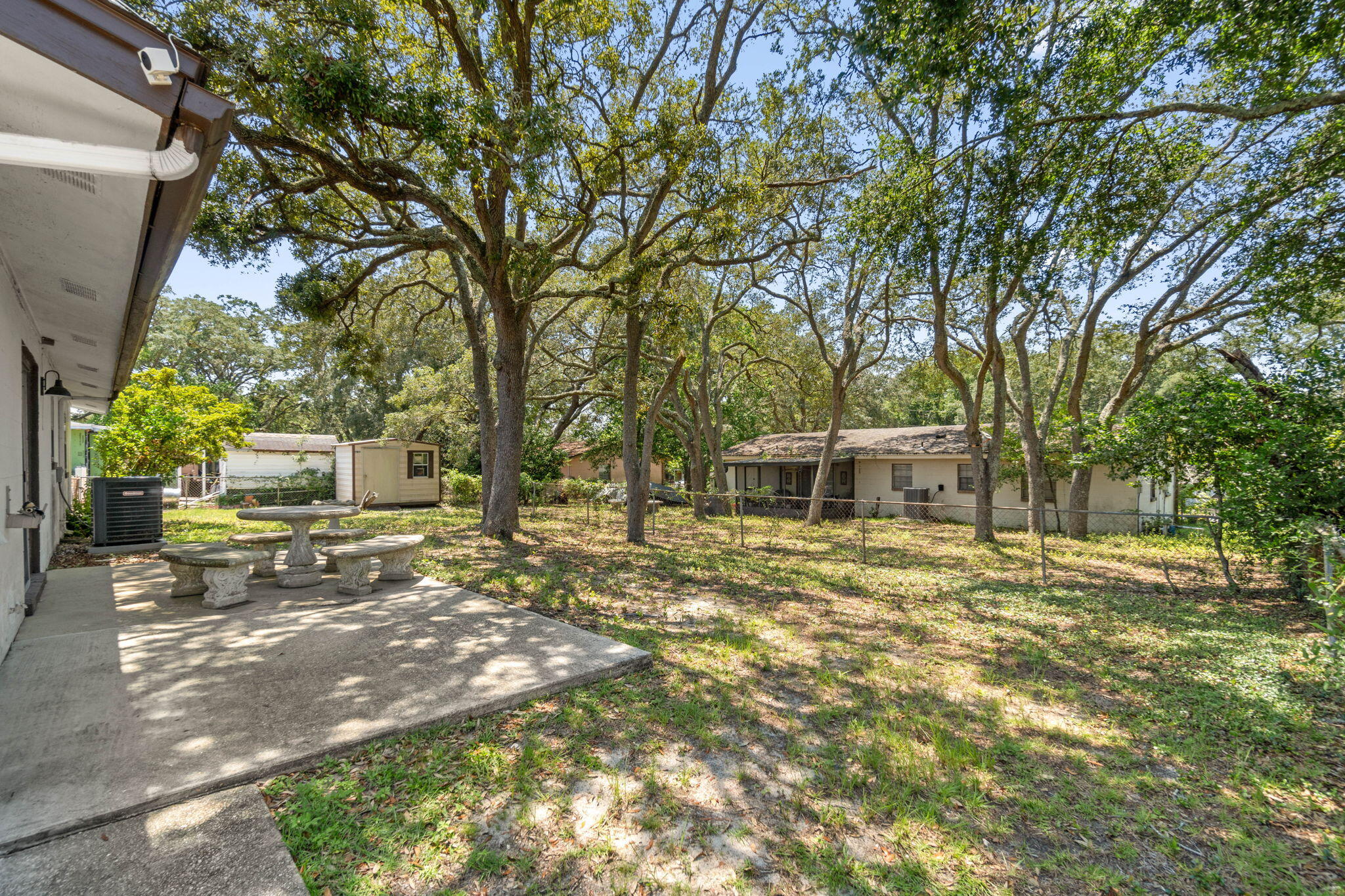 55 12th Street Shalimar, FL 32579 - Photo 20 of 22 a view of a yard with plants and trees