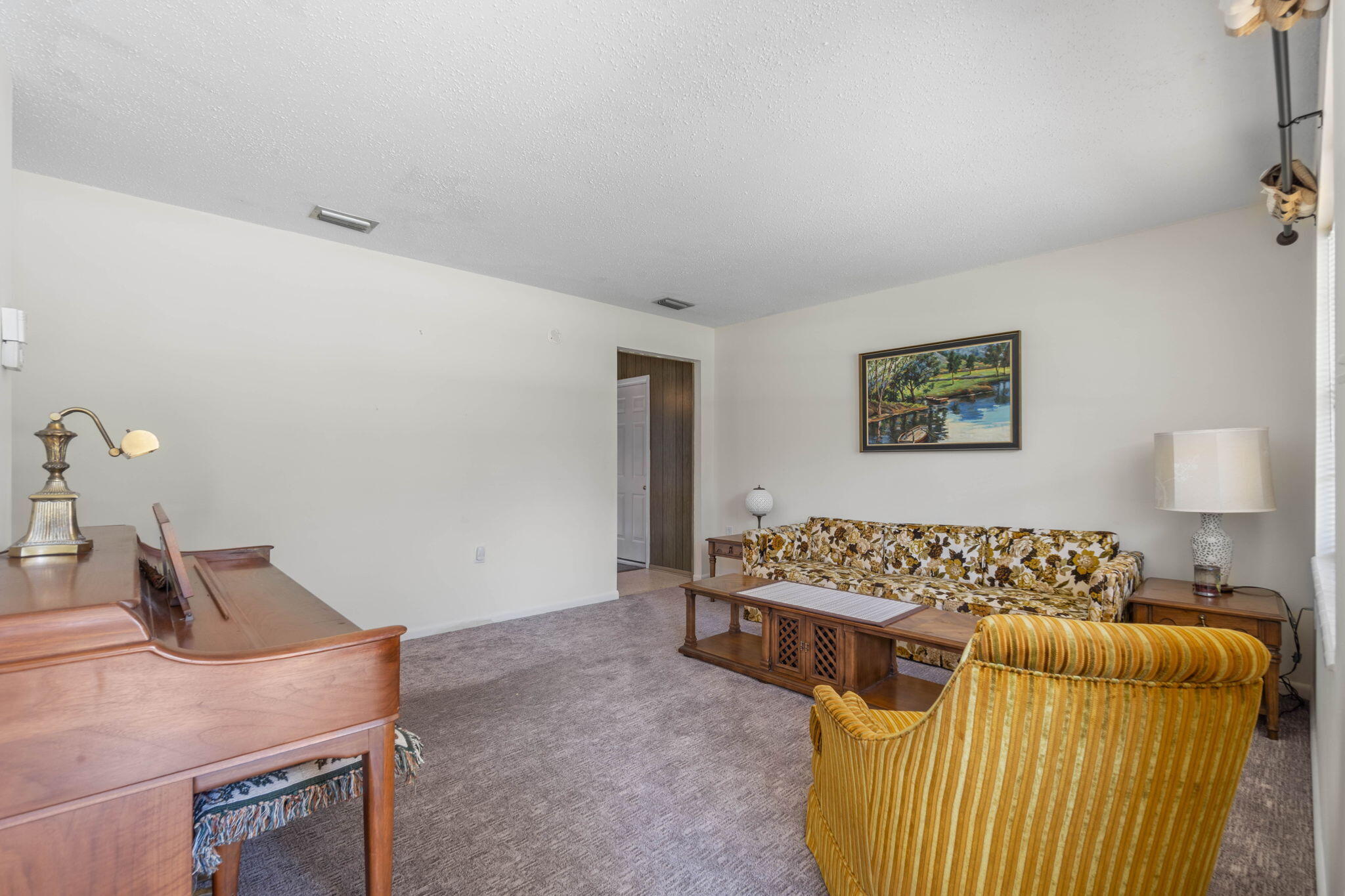 55 12th Street Shalimar, FL 32579 - Photo 4 of 22 a bedroom with a bed and painting on the wall