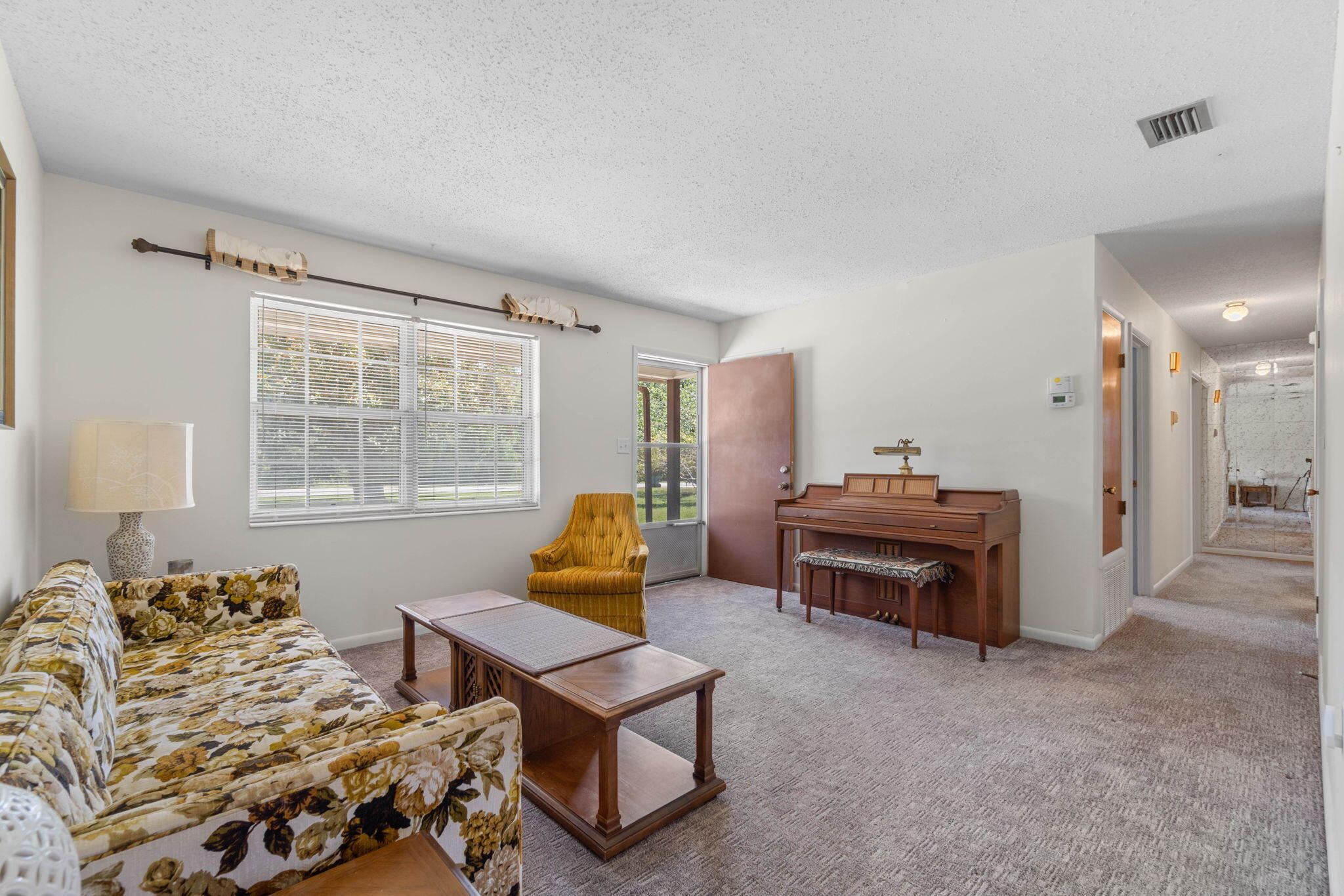 55 12th Street Shalimar, FL 32579 - Photo 5 of 22 a living room with furniture and a window