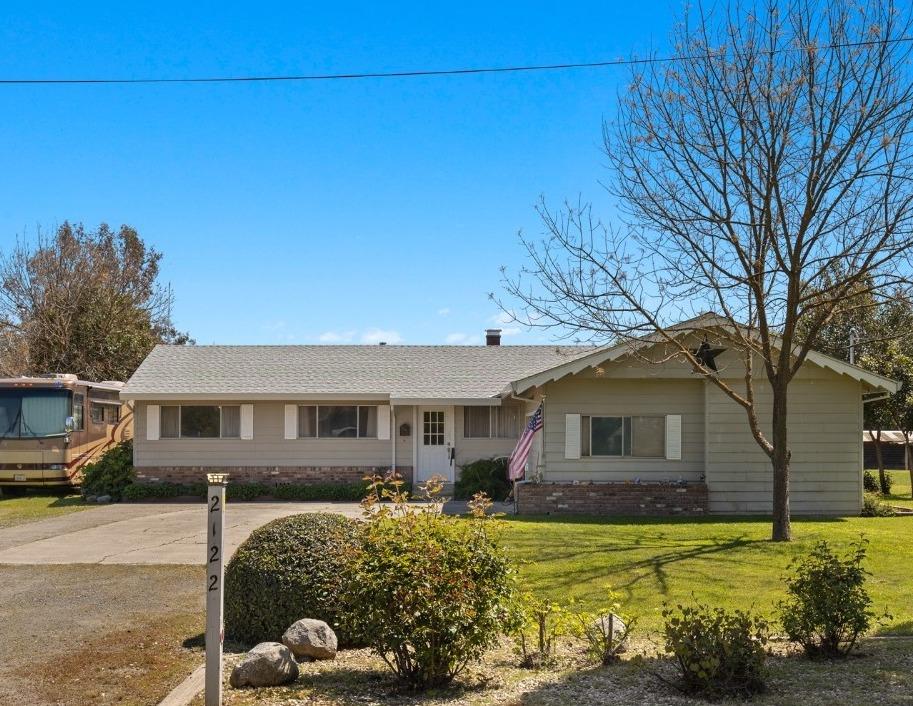 2122 Larkin Road Biggs, CA 95917 - Photo 1 of 1 a front view of a house with a yard