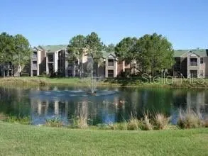a view of a lake with a building in the background