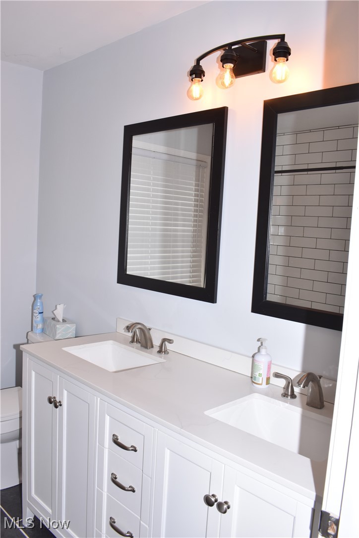 525 Harding Road Zanesville, OH 43701 - Photo 8 of 22 Bathroom featuring toilet and vanity. Recently remodeled