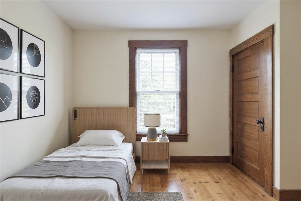 144 A Street Lowell, MA 01851 - Photo 22 of 32 a bedroom with bed and a window