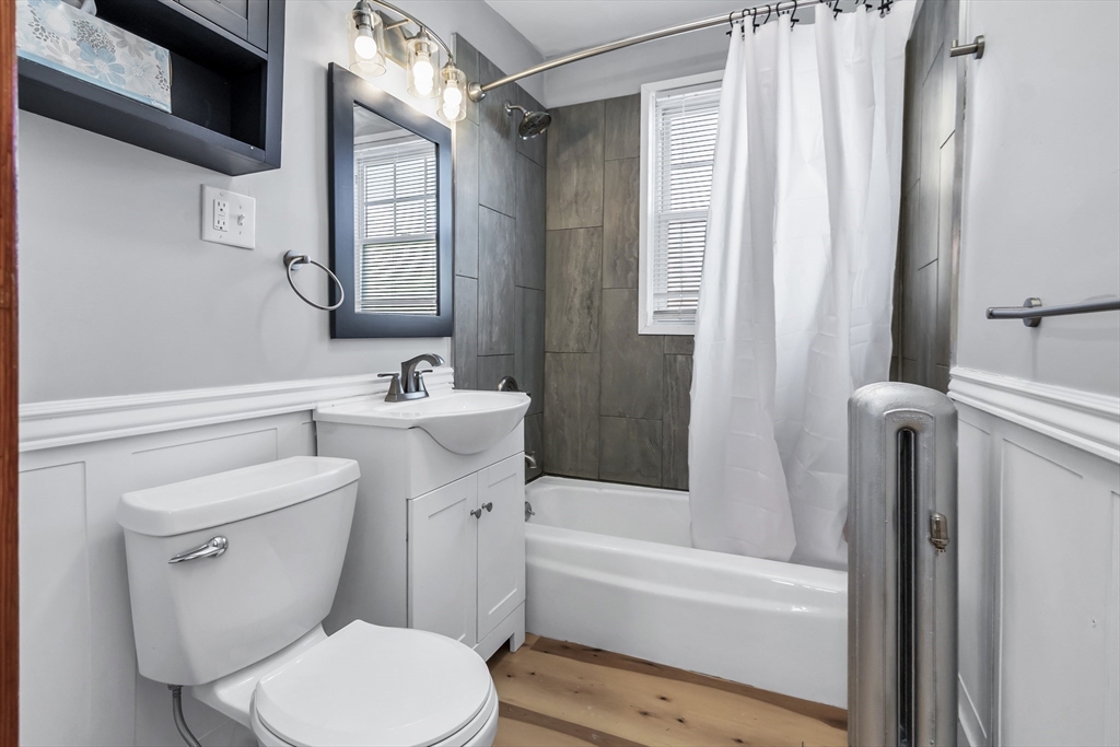 144 A Street Lowell, MA 01851 - Photo 29 of 32 a bathroom with a sink toilet and shower