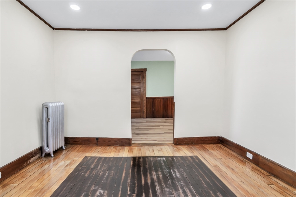 144 A Street Lowell, MA 01851 - Photo 7 of 32 a view of empty room with wooden floor