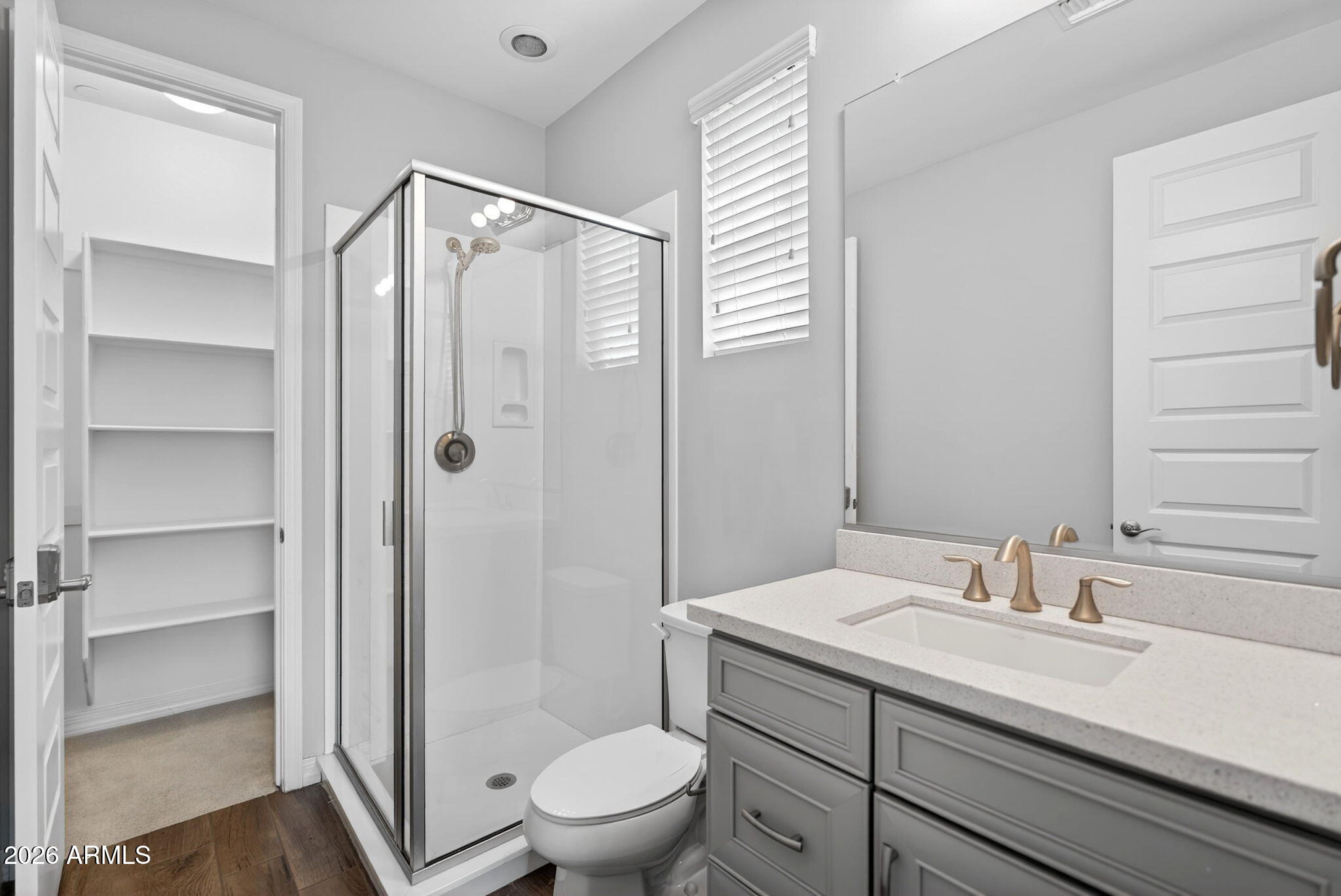 12124 West Peak View Road Peoria, AZ 85383 - Photo 26 of 38 a bathroom with a shower sink vanity mirror and toilet