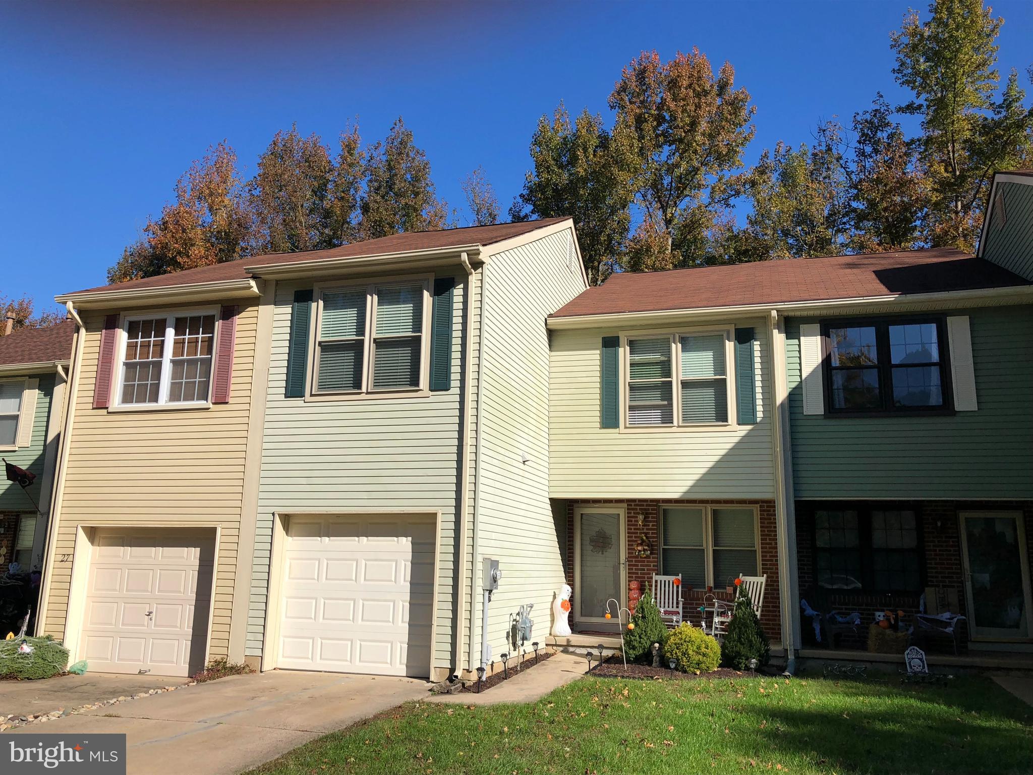 26 Stanwood Court Medford, NJ 08055 - Photo 1 of 19 a front view of a house with a garden and plants