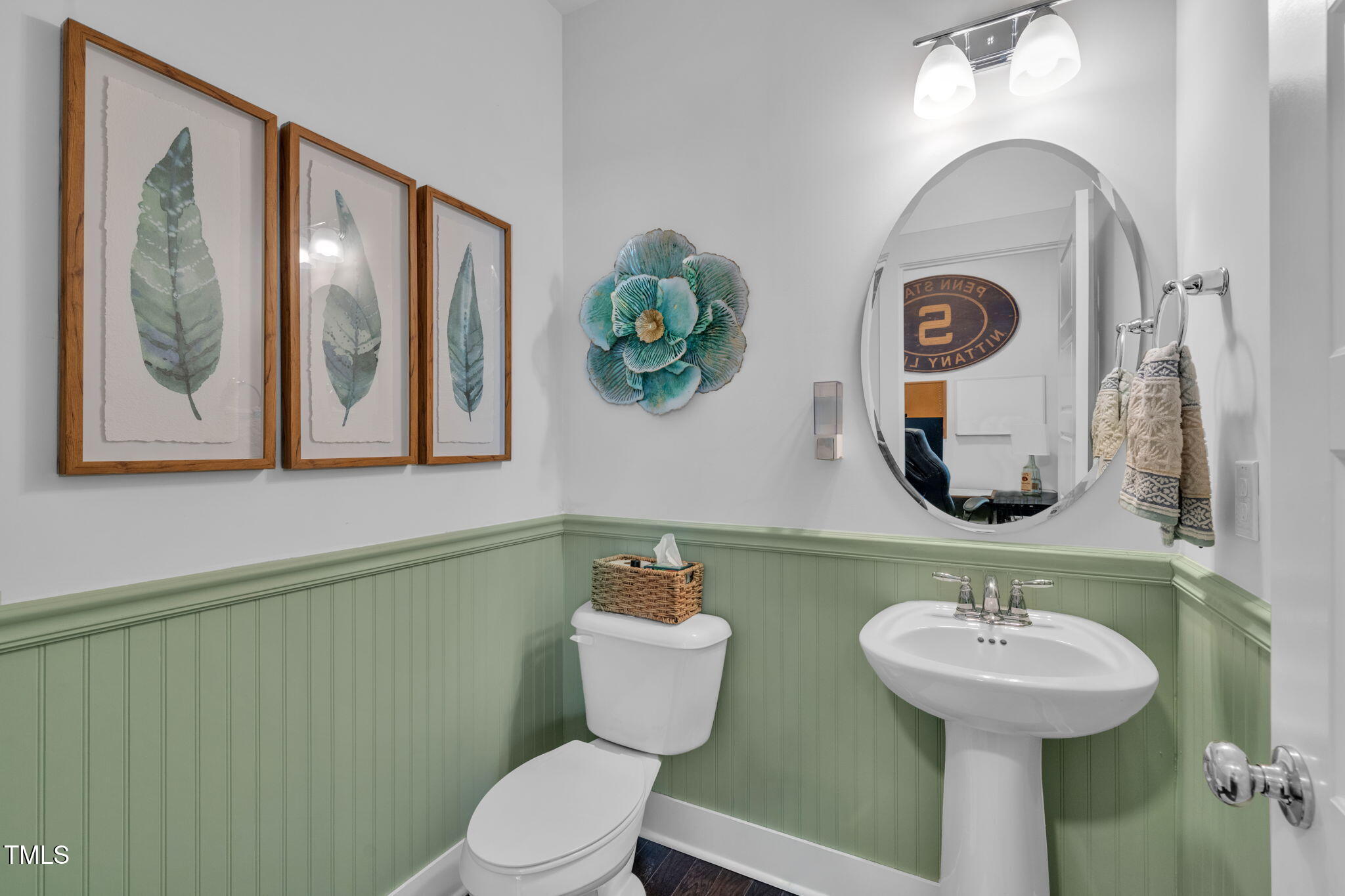 257 Douglas Falls Drive Wendell, NC 27591 - Photo 11 of 34 a bathroom with a toilet a sink and mirror