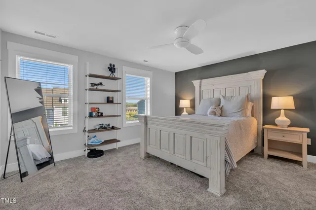 a bedroom with furniture and a window