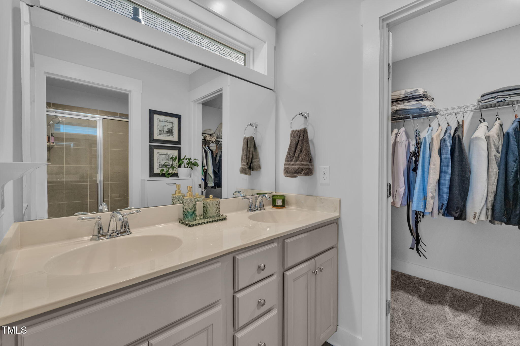 257 Douglas Falls Drive Wendell, NC 27591 - Photo 15 of 34 a bathroom with a double vanity sink and a mirror
