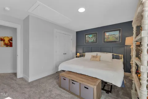 a room with a bed and furniture