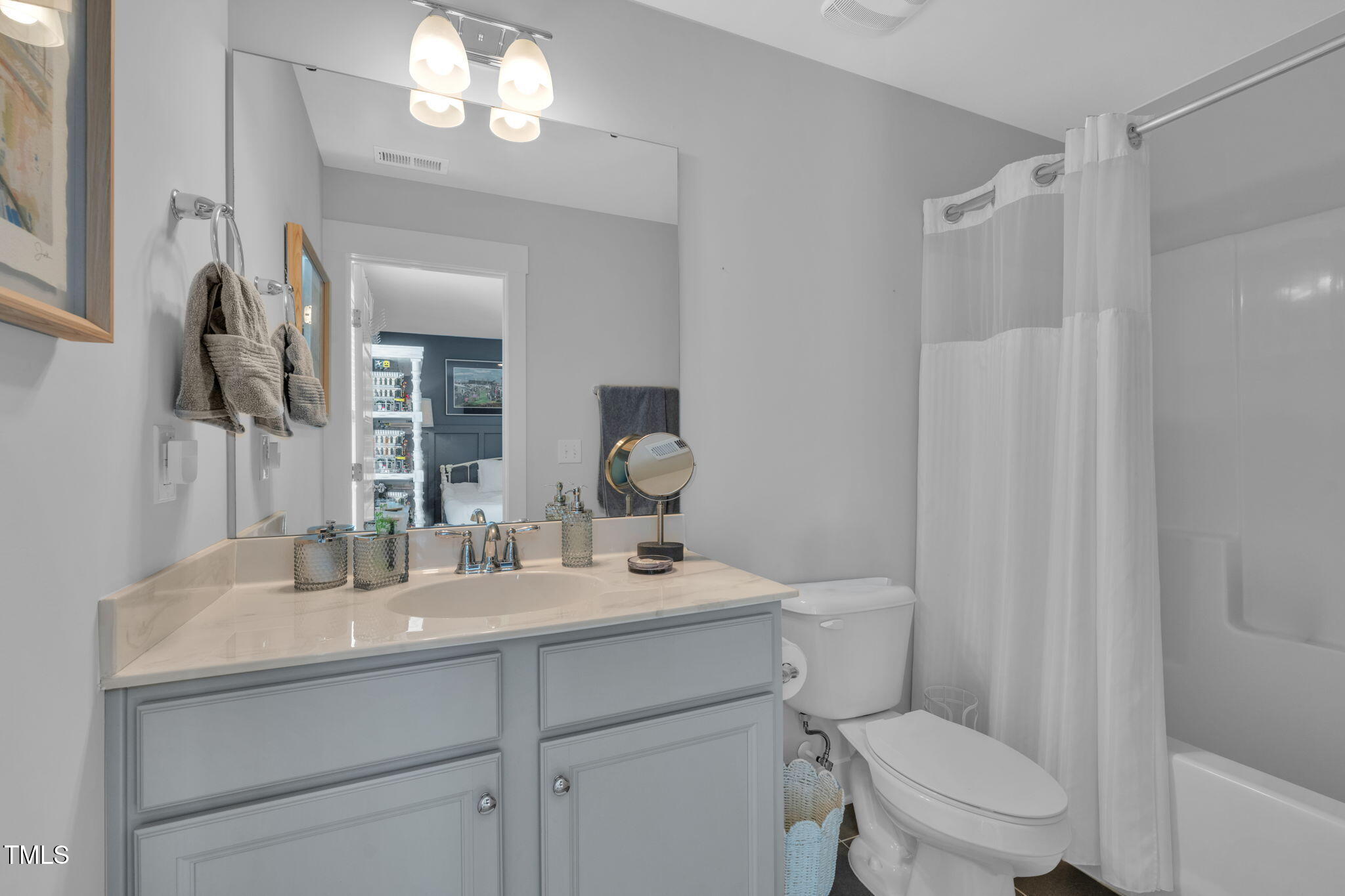 257 Douglas Falls Drive Wendell, NC 27591 - Photo 20 of 34 a bathroom with a sink a toilet and shower