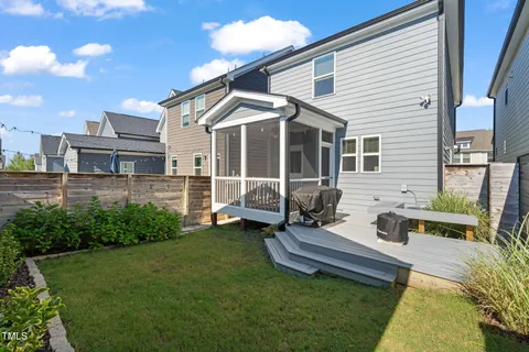 a front view of a house with garden and deck