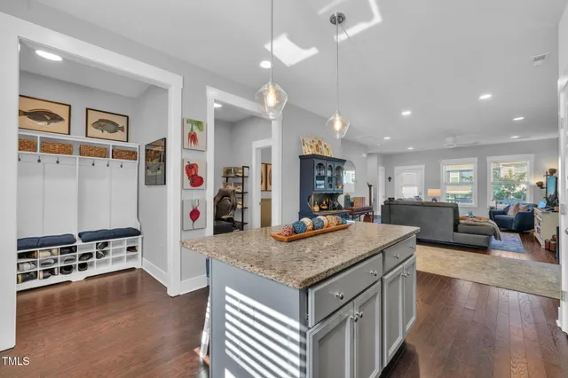a large kitchen with a table and chairs in it