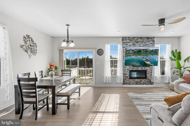 a dining room with furniture a livingroom and chandelier