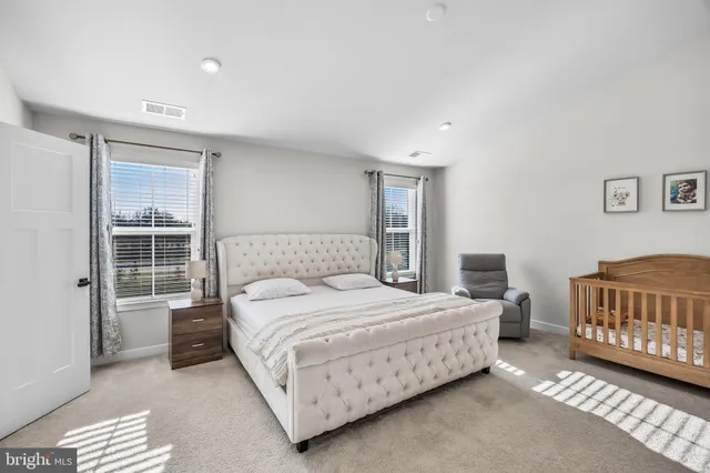 a bedroom with a bed and dresser