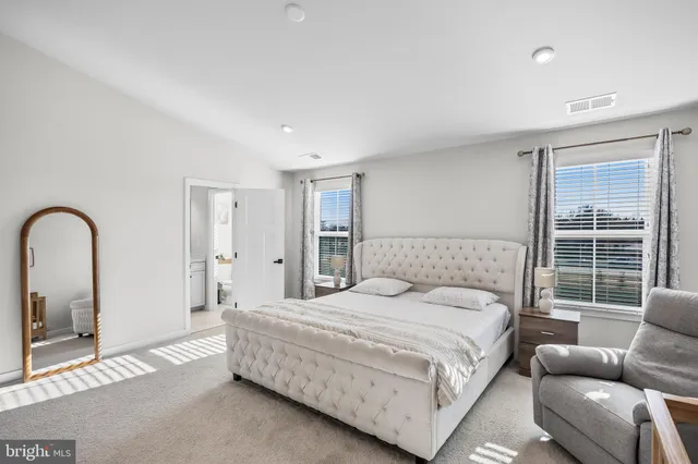 a bathroom with a shower sink and mirror