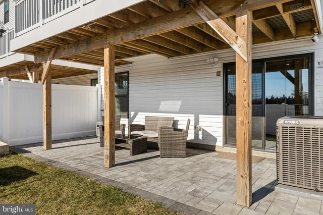 a patio with table and chairs