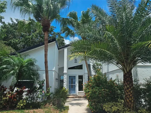 front view of a house with a garden