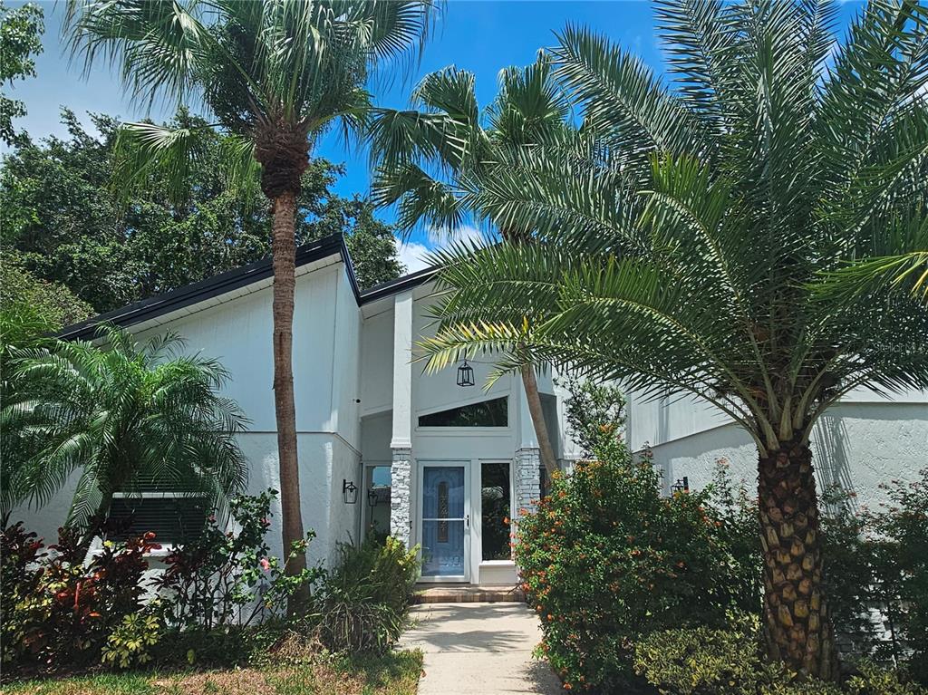 front view of a house with a garden