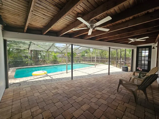 a view of swimming pool with outdoor seating