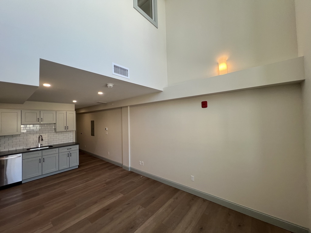 160 Seabury Street, Unit 40 Fall River, MA 02720 - Photo 12 of 13 a kitchen with granite countertop a sink and cabinets