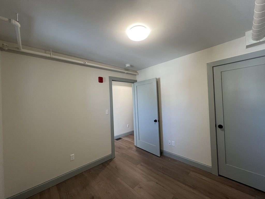 160 Seabury Street, Unit 40 Fall River, MA 02720 - Photo 7 of 13 a view of hallway with wooden floor