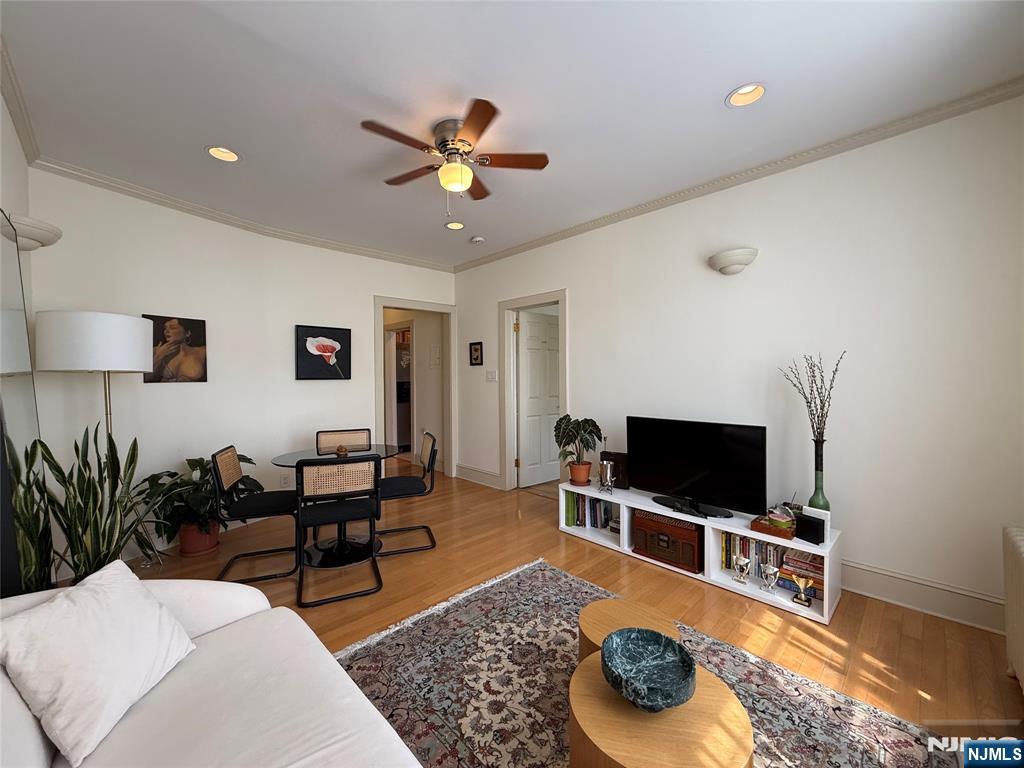 215 Orient Way, Unit C2 Rutherford, NJ 07070 - Photo 4 of 25 a living room with furniture and a flat screen tv