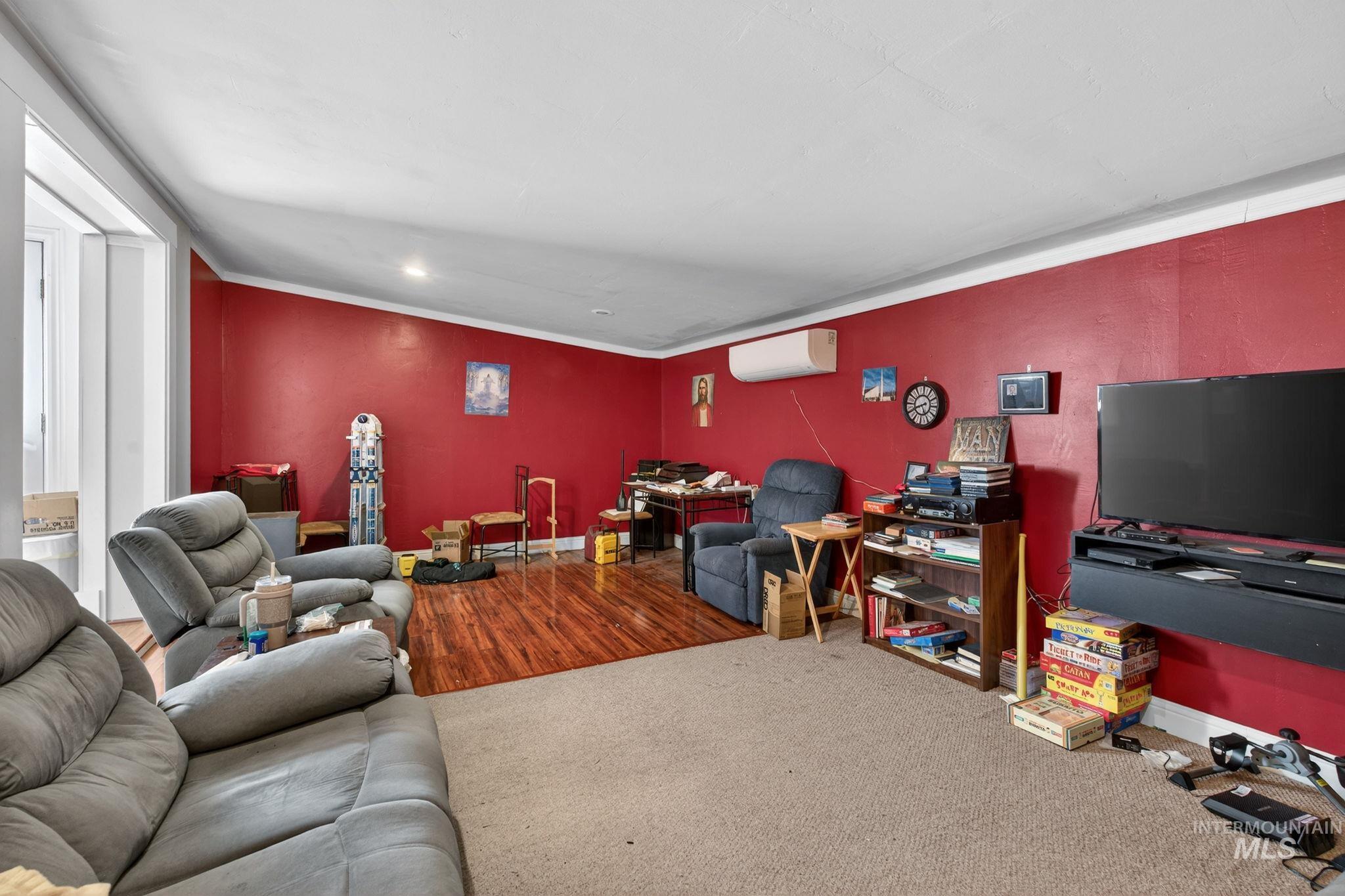 208 South 4th W Street Preston, ID 83263 - Photo 16 of 38 Living room featuring carpet and ornamental molding