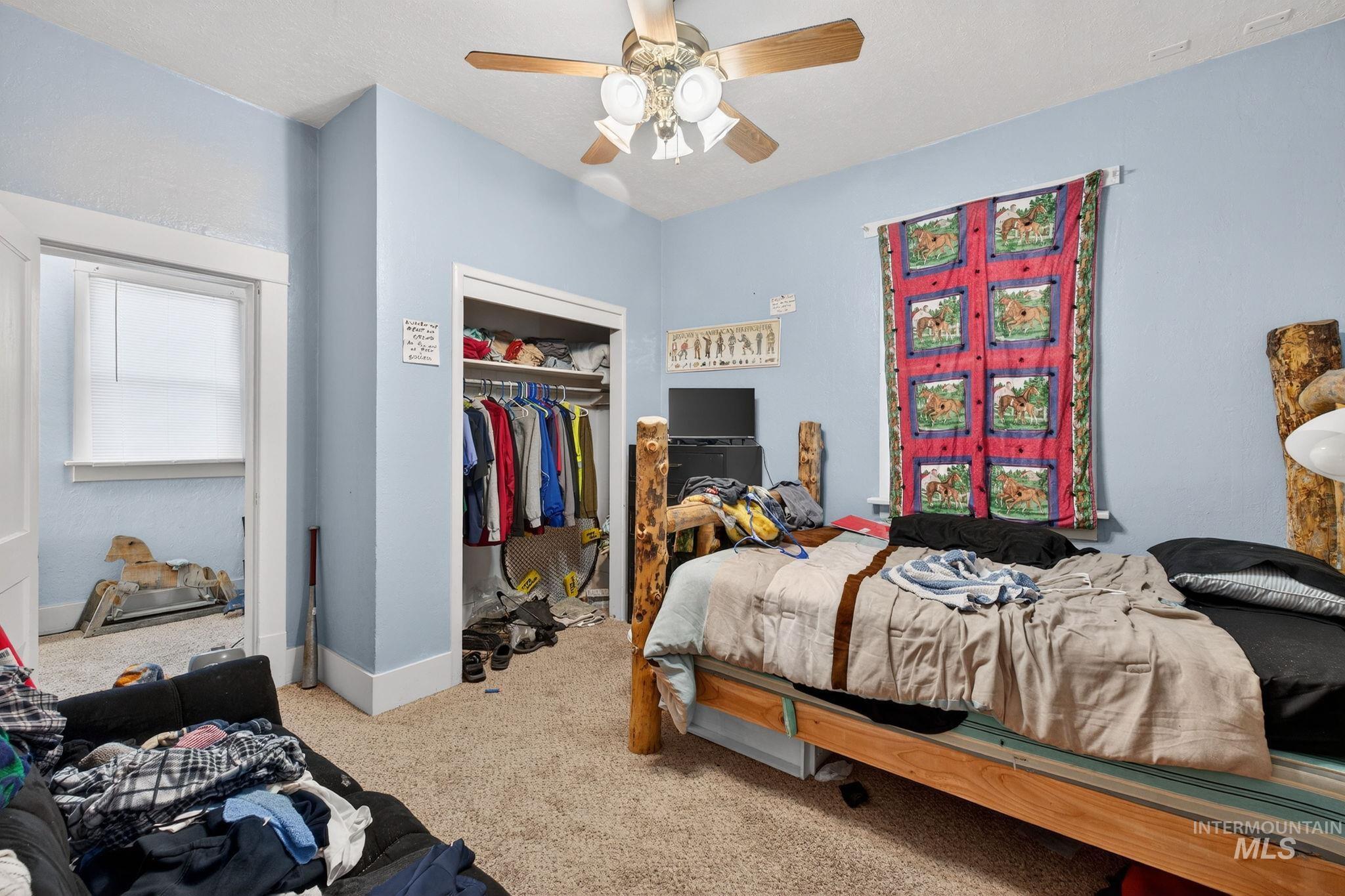 208 South 4th W Street Preston, ID 83263 - Photo 22 of 38 Carpeted bedroom featuring a closet and a ceiling fan