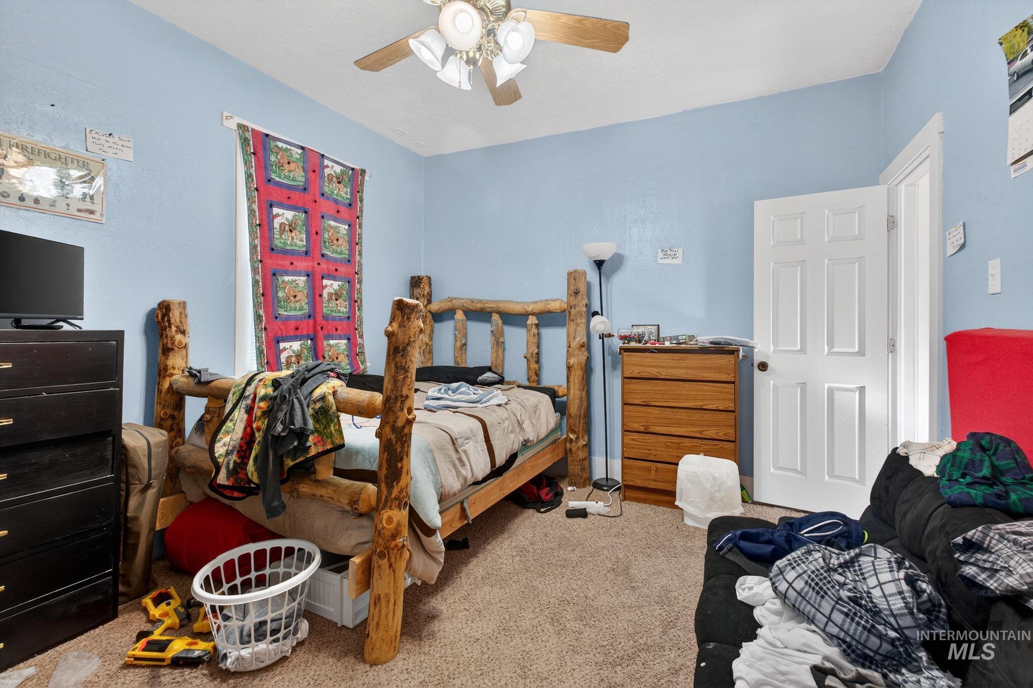208 South 4th W Street Preston, ID 83263 - Photo 23 of 38 Carpeted bedroom featuring ceiling fan