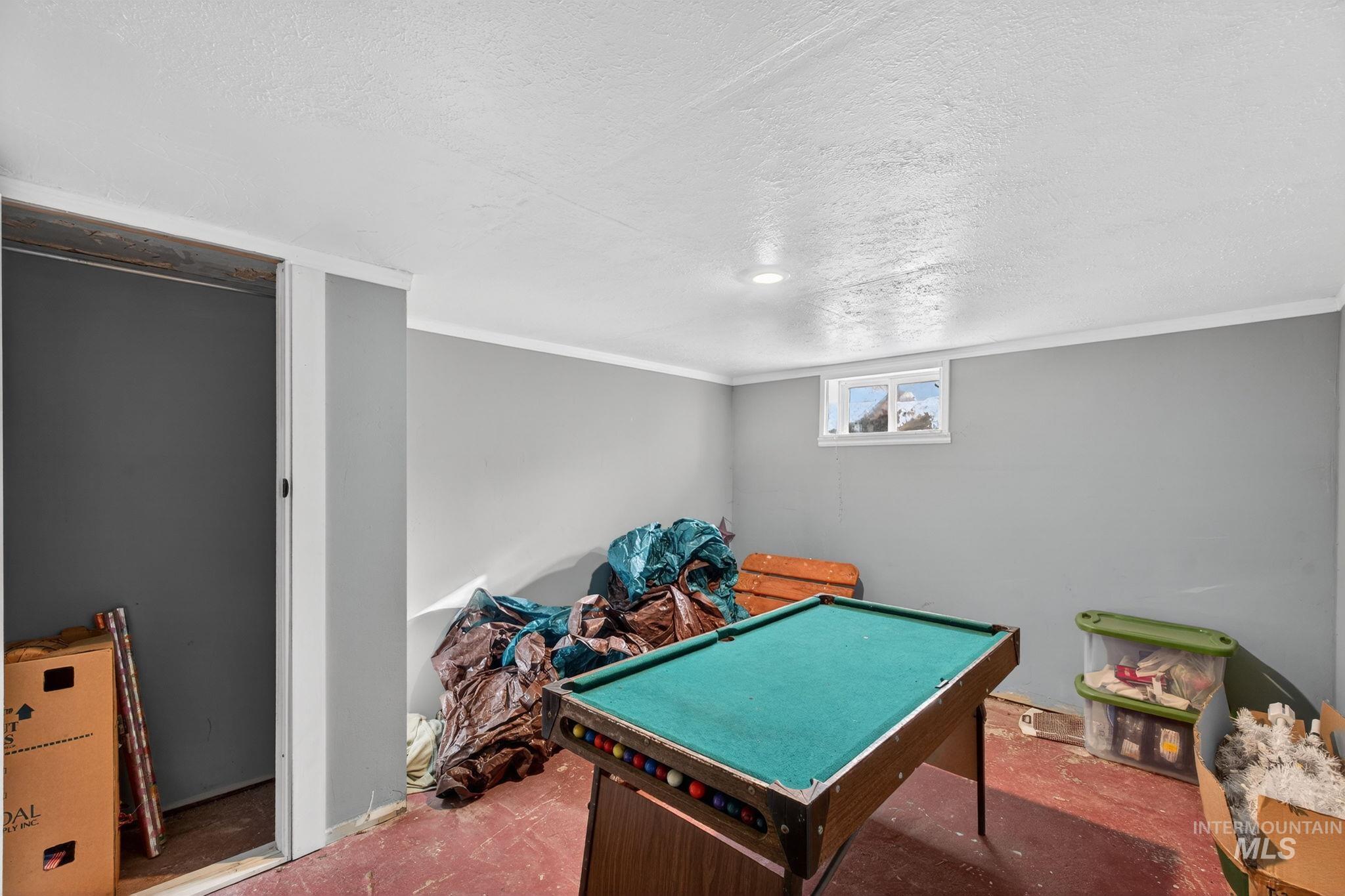 208 South 4th W Street Preston, ID 83263 - Photo 29 of 38 Game room with a textured ceiling, carpet flooring, and billiards table