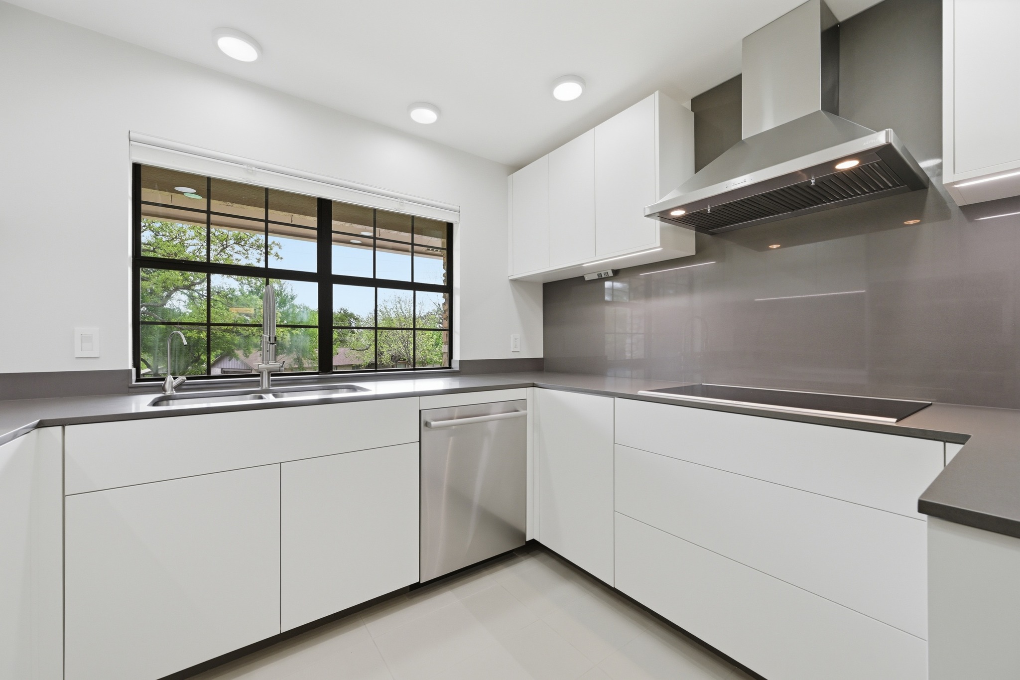 320 Ridgecrest Road Georgetown, TX 78628 - Photo 12 of 39 a kitchen with granite countertop white cabinets and a sink