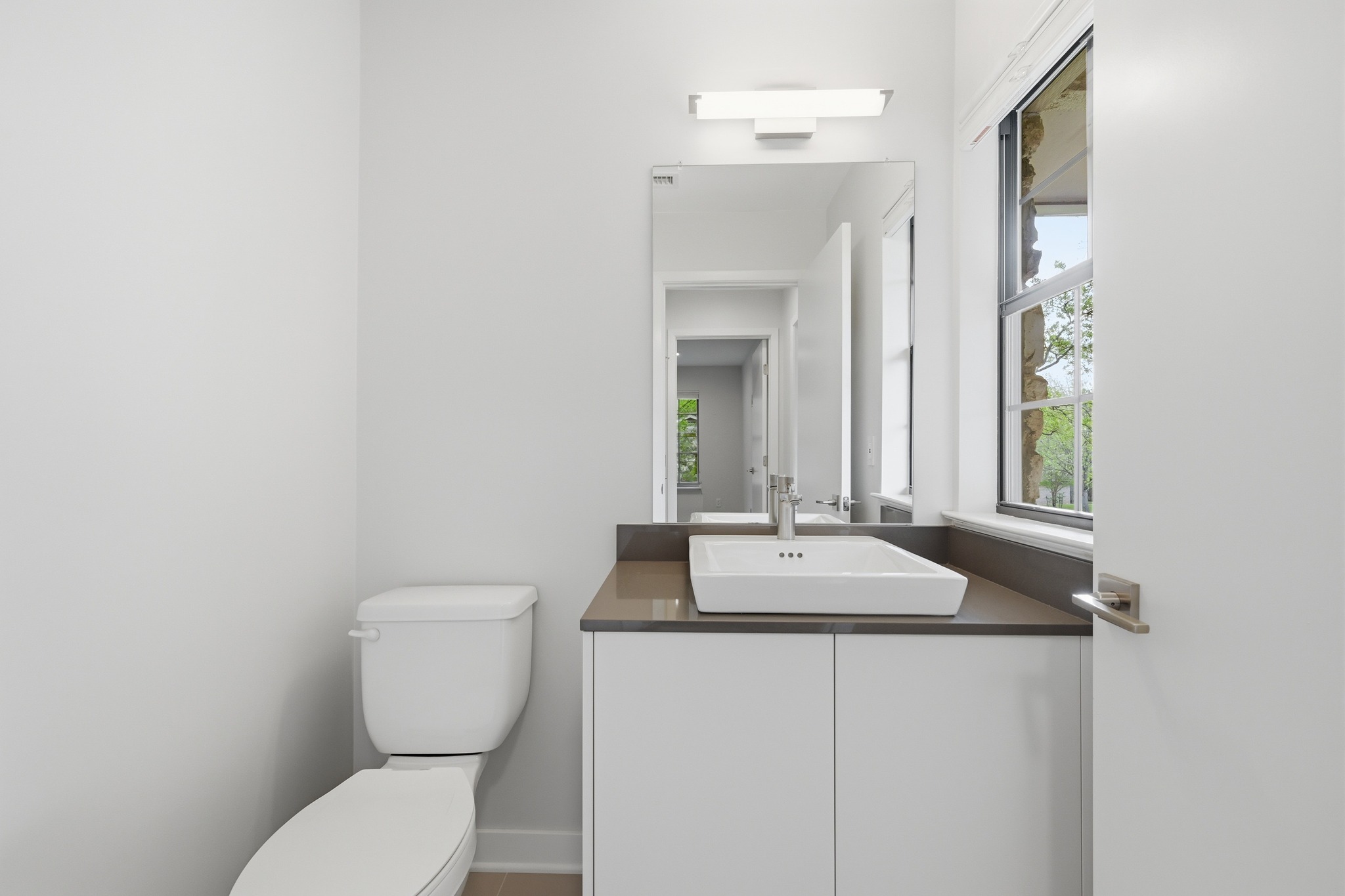 320 Ridgecrest Road Georgetown, TX 78628 - Photo 16 of 39 a bathroom with a toilet sink and mirror