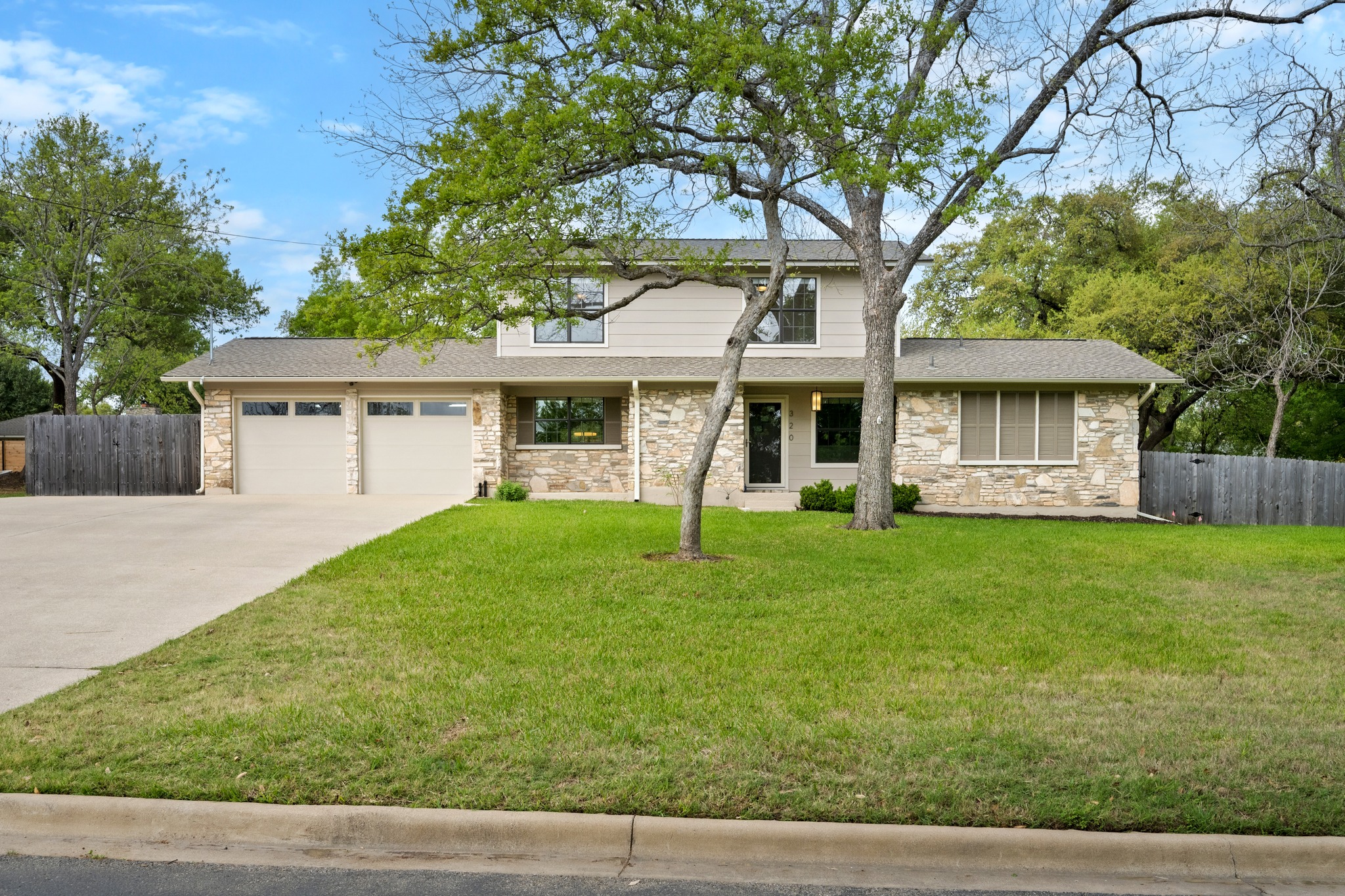 320 Ridgecrest Road Georgetown, TX 78628 - Photo 2 of 39 a front view of a house with a yard